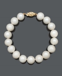 Freshen your look with a simple strand of crisp, white pearls. This polished bracelet features cultured freshwater pearls (10-11 mm) with a 14k gold clasp. Approximate length: 7-1/2 inches. Freshen your look with a simple strand of crisp, white pearls. This polished bracelet features cultured freshwater pearls (10-11 mm) with a 14k gold clasp. Approximate length: 7-1/2 inches.