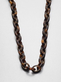 A long, glossy tortoise print link design detailed with radiant goldtone accents. AcetateIon-plated steelLength, about 34Push button closureImported A long, glossy tortoise print link design detailed with radiant goldtone accents. AcetateIon-plated steelLength, about 34Push button closureImported