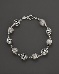 Inspired by Zen philosophy, this intricately detailed sterling silver bracelet from Paul Morelli softly jingles with meditation bells. Inspired by Zen philosophy, this intricately detailed sterling silver bracelet from Paul Morelli softly jingles with meditation bells.