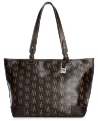 A blast from the past, this classic design from Dooney & Bourke gives a nod to its '70s signature style. Adorned with the iconic DB monogram and discrete hardware, its spacious shape carries off your essentials with ease. A blast from the past, this classic design from Dooney & Bourke gives a nod to its '70s signature style. Adorned with the iconic DB monogram and discrete hardware, its spacious shape carries off your essentials with ease.
