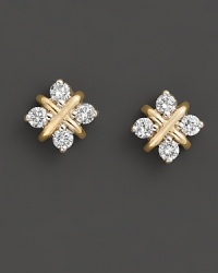 With four diamonds in a 14 Kt. yellow gold setting, these stud earrings brings a classic sense of style to your look. With four diamonds in a 14 Kt. yellow gold setting, these stud earrings brings a classic sense of style to your look.