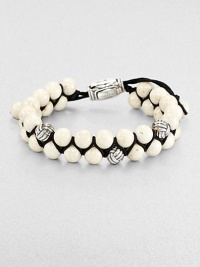 From the Spirited Bead Collection, this two-row beaded bracelet is handsomely crafted from 8mm river stone beads, featuring three silver monkey fist beads and an adjustable clasp.Sterling silverRiver stoneAbout 9 longAbout 3 diam.Imported From the Spirited Bead Collection, this two-row beaded bracelet is handsomely crafted from 8mm river stone beads, featuring three silver monkey fist beads and an adjustable clasp.Sterling silverRiver stoneAbout 9 longAbout 3 diam.Imported