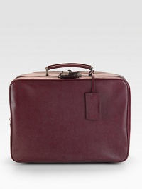 Duel side zip closures and interior straps. Top handle Top zipper lock Address tag Interior zip pocket Fully lined Leather 17W X 11¾H X 7D Made in Italy Duel side zip closures and interior straps. Top handle Top zipper lock Address tag Interior zip pocket Fully lined Leather 17W X 11¾H X 7D Made in Italy