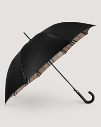Stay warm, dry and stylish with a check-lined Burberry umbrella. Stay warm, dry and stylish with a check-lined Burberry umbrella.
