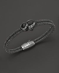 Di MODOLO's iconic sig piece is strung on a double strand bracelet, crafted in rhodium plated sterling silver. Di MODOLO's iconic sig piece is strung on a double strand bracelet, crafted in rhodium plated sterling silver.