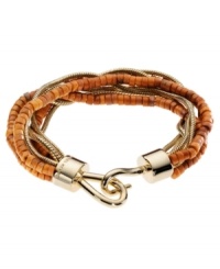 Bohemian bliss. Beaded strands of semi-precious dyed howlite adorn Michael Kors' beautiful multi-strand bracelet. Hook clasp and chain accents are crafted in gold tone mixed metal. Approximate length: 7-1/2 inches. Bohemian bliss. Beaded strands of semi-precious dyed howlite adorn Michael Kors' beautiful multi-strand bracelet. Hook clasp and chain accents are crafted in gold tone mixed metal. Approximate length: 7-1/2 inches.