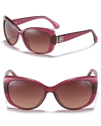 In a chic pink hue, these MICHAEL Michael Kors cat eye sunglasses showcase the on-trend shape with feminine flair. In a chic pink hue, these MICHAEL Michael Kors cat eye sunglasses showcase the on-trend shape with feminine flair.