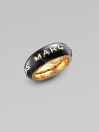 A simple band of black enamel displays the designer's imprint in raised golden letters. Enamel Brass Width, about ¾ Adjusts from Size 6 to Size 8 Imported