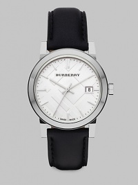 An iconic check stamped dial with a sleek stainless steel case and a supple leather strap. Swiss quartz movementWater resistant to 5 ATMRound stainless steel case, 34mm (1.3)Smooth bezelSilver check stamped dialBar hour markersDate display at 3 o'clockSecond hand Black leather strapMade in Switzerland An iconic check stamped dial with a sleek stainless steel case and a supple leather strap. Swiss quartz movementWater resistant to 5 ATMRound stainless steel case, 34mm (1.3)Smooth bezelSilver check stamped dialBar hour markersDate display at 3 o'clockSecond hand Black leather strapMade in Switzerland