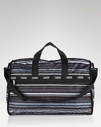 Travel lighter with this nylon LeSportsac weekender, designed in durable and easy to clean nylon. A new for the season print makes this signature style feel fresh. Travel lighter with this nylon LeSportsac weekender, designed in durable and easy to clean nylon. A new for the season print makes this signature style feel fresh.