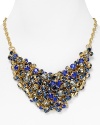 There's nothing quiet about this clustered bib necklace from Aqua with flaunts a chic cluster of multi colored crystals and stones. Turn up the volume.