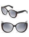 Leopard print underlines the cat in cat eye in these fashion-forward Dior sunglasses, featuring round, oversized lenses.