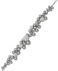 Simply stunning! Swarovski's exquisitely-crafted bracelet features a majestic accumulation of grey crystal pearls. Delicate details in clear crystal Pointiage® add gorgeous sparkle. Crafted in rhodium-plated mixed metal. Approximate length: 6-1/2 inches. Simply stunning! Swarovski's exquisitely-crafted bracelet features a majestic accumulation of grey crystal pearls. Delicate details in clear crystal Pointiage® add gorgeous sparkle. Crafted in rhodium-plated mixed metal. Approximate length: 6-1/2 inches.