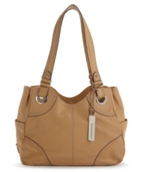 A contoured cutout, contrast stitching and shiny eyelets bring stylish energy to this Tignanello shopper. A contoured cutout, contrast stitching and shiny eyelets bring stylish energy to this Tignanello shopper.