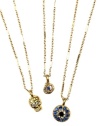 Mystical and mysterious, RACHEL Rachel Roy's trio necklace conveys edgy glamour with skull, snake and evil eye pendants. Made in gold tone mixed metal with glass crystal accents. Approximate length: 18 inches + 2-inch extender. Approximate drop: 1/2 inch to 1 inch.