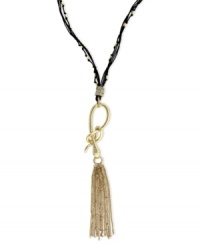 Slip into something new. Jessica Simpson's necklace is crafted from gold-tone mixed metal with a stylish tassel pendant. A snake motif adorns the black chord for a bit of an edge. Approximate length: 28 inches + 6-inch drop. Slip into something new. Jessica Simpson's necklace is crafted from gold-tone mixed metal with a stylish tassel pendant. A snake motif adorns the black chord for a bit of an edge. Approximate length: 28 inches + 6-inch drop.