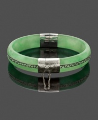 Effortless and chic, this simple slip-on style creates a look of polished elegance. A Greek-key pattern adds character to this solid jade bangle (10-1/2 mm-13 mm). Accents and clasp crafted in sterling silver. Approximate diameter: 2-1/4 inches. Effortless and chic, this simple slip-on style creates a look of polished elegance. A Greek-key pattern adds character to this solid jade bangle (10-1/2 mm-13 mm). Accents and clasp crafted in sterling silver. Approximate diameter: 2-1/4 inches.