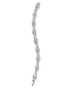 Glittering crystal stations take this Nadri bracelet somewhere decidedly glamorous, framed by classic rhodium plated links.