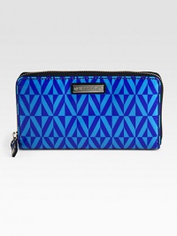 A slim zip-around design of coated fabric with an eye-catching geometric print. Zip-around closureOne inside zip pocketTwo bill compartmentsTwelve credit card slotsFully lined7½W X 4½H X 1DImported A slim zip-around design of coated fabric with an eye-catching geometric print. Zip-around closureOne inside zip pocketTwo bill compartmentsTwelve credit card slotsFully lined7½W X 4½H X 1DImported