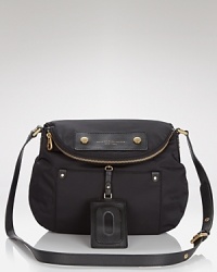 In durable nylon, MARC BY MARC JACOBS' crossbody is a coolly versatile choice. Store your essentials while staying chic by slipping it over your shoulder. In durable nylon, MARC BY MARC JACOBS' crossbody is a coolly versatile choice. Store your essentials while staying chic by slipping it over your shoulder.