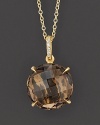 Pavé diamonds and smoky quartz sparkle in a 18K yellow gold setting.