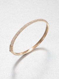 From the Brilliance Collection. Half of this graceful bangle is paved with sparkling rhinestones, the other half has a smooth, polished finish, with a handy hinge in between the two.GlassRose goldtoneDiameter, about 2.5Hinged with push-lock claspImported From the Brilliance Collection. Half of this graceful bangle is paved with sparkling rhinestones, the other half has a smooth, polished finish, with a handy hinge in between the two.GlassRose goldtoneDiameter, about 2.5Hinged with push-lock claspImported