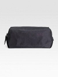 A travel essential for an overnight jaunt or weeklong vacation in durable, textured nylon. Zip closure 11W X 5H X 5D Made in Italy A travel essential for an overnight jaunt or weeklong vacation in durable, textured nylon. Zip closure 11W X 5H X 5D Made in Italy