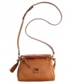 Keep your look classic with this timeless Dooney & Bourke crossbody. An iconic front emblem and refined tassel embodies the designer's quintessential style and grace.