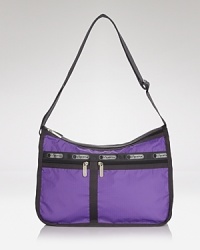 Nothing too tricky here: just an effortless top handle LeSportsac tote featuring a zip top closure, crafted in the brand's unmistakable nylon. Nothing too tricky here: just an effortless top handle LeSportsac tote featuring a zip top closure, crafted in the brand's unmistakable nylon.