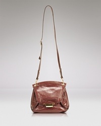 This sized-down crossbody from Kooba is so right for day-to-night, crafted in right leather with a coolly versatile shape. This sized-down crossbody from Kooba is so right for day-to-night, crafted in right leather with a coolly versatile shape.