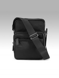 Durable nylon with outside zip pocket and adjustable shoulder strap. Top zip closure Outside zip pocket Inside zip pocket Jacquard lining 7W X 9½H X 4D Made in Italy Durable nylon with outside zip pocket and adjustable shoulder strap. Top zip closure Outside zip pocket Inside zip pocket Jacquard lining 7W X 9½H X 4D Made in Italy