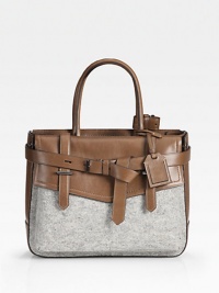 An exceedingly versatile silhouette of rich felt against sumptuous leather, finished with a tailored flap front and buckled belt.Double top handles, 5½ drop One outside flap pocket Protective metal feet One inside zip pocket Two inside open pockets Center zip compartment Two center compartments Cotton lining 12¾W X 10H X 3¾D Imported An exceedingly versatile silhouette of rich felt against sumptuous leather, finished with a tailored flap front and buckled belt.Double top handles, 5½ drop One outside flap pocket Protective metal feet One inside zip pocket Two inside open pockets Center zip compartment Two center compartments Cotton lining 12¾W X 10H X 3¾D Imported