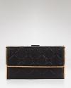 Effortlessly blending style and functionality, this Longchamp wallet is a polished pick up, crafted of leather and secured with a simple snap closure which opens to a well-organized interior.