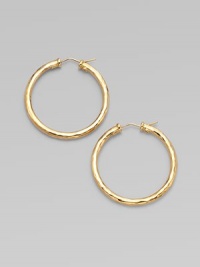 From the Martellato Collection. Graceful hoops with a rich hammered texture in gleaming 18k gold.18k yellow goldDiameter, about 1¾PiercedMade in Italy From the Martellato Collection. Graceful hoops with a rich hammered texture in gleaming 18k gold.18k yellow goldDiameter, about 1¾PiercedMade in Italy