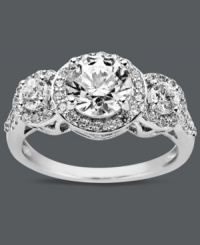 Stun them with sparkles! Arabella's glittering three stone ring features round-cut Swarovski zirconias (3-1/3 ct. t.w.) encircled by glittering zirconia accents. Crafted in sterling silver. Size 7. Stun them with sparkles! Arabella's glittering three stone ring features round-cut Swarovski zirconias (3-1/3 ct. t.w.) encircled by glittering zirconia accents. Crafted in sterling silver. Size 7.