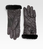 Trimmed in soft shearling, this quilted style mixes function and fashion. Leather palmElastic drawstring cuffDyed sheepskin shearlingFill: polyesterAbout 10½ longSpecialist dry cleanImportedFur origin: Spain