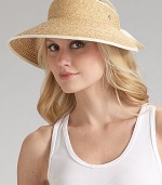 Packable wide brim raffia is accented with cotton ribbon detailing. About 4 brim Adjustable One size Spot clean Imported