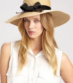 A charming design with a glossy bow accent to keep the sun out of your eyes. PolyesterBrim, about 4Imported