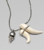 Swarovski crystal accented skull and tusk-shaped pendants on a link chain. BrassSwarovski crystalsLength, about 27Pendant size, about 2 and 1½ Lobster clasp closureMade in Italy