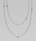 From the Petite Pavé Bead Collection. A long and graceful box-link chain of shining sterling silver, sprinkled with shimmering pavé diamond beads. Diamonds, 0.59 tcw Sterling silver Length, about 36 Lobster clasp Imported