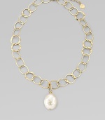 A large, lovely baroque pearl is suspended from a chain of hammered open links. 22mm white baroque organic man-made pearl 18k goldplated sterling silver Length, about 16 with 2 extender Lobster clasp Made in Spain