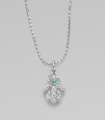 The open hand, a traditional symbol of protection, set with pavé diamonds and a vibrant turquoise center on a 14k white gold ball chain.Diamonds, 0.06 tcw 14k yellow gold Chain length, about 16 Pendant length, about ½ Lobster clasp Imported