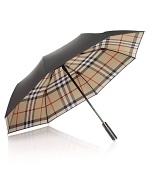 Shield yourself from inclement weather with an iconic umbrella from Burberry.