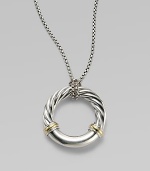 From the Metro Collection. A sleek, sophisticated circle, combining smooth and cabled sterling silver with accents of 18k gold, hangs from a richly textured silver chain and bale. Sterling silver and 18k yellow gold Chain length, about 18 Pendant diameter, about 1¼ Spring ring clasp Imported