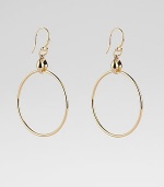 From the Marina Collection. A polished, tubular hoop suspends from a distinctively sculpted link. 18k yellow gold Diameter, about 1½ Ear wire Made in Italy
