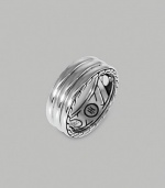 A ridged band of fine silver is finished with etched deisgns on the sides and inside of the band. From the Bedeg Collection Silver 0.35 wide Imported 