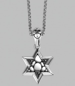 A stunningly appointed Star of David pendant, accented by black sapphires on a silver chain necklace. From the Kali Collection Silver Black sapphires, 0.216 tcw Pendant, ¾W X 1½H Necklace, 36 long Lobster clasp Imported 
