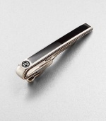 A timeless sartorial standard in smooth sterling silver with black onyx inlay.Sterling silverBlack onyxAbout 2 longImported