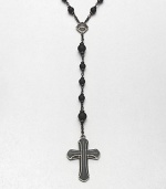 A simple, yet masculine addition to your ensemble, with a strand black onyx beads complemented by a sterling silver cross pendant.Sterling silverBlack onyxAbout 37, inner diam.About 7 dropImported