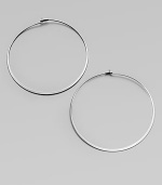 Make a quiet statement in these elegant hoop earrings. Silvertone metalLength, about 2.25Post closureImported 